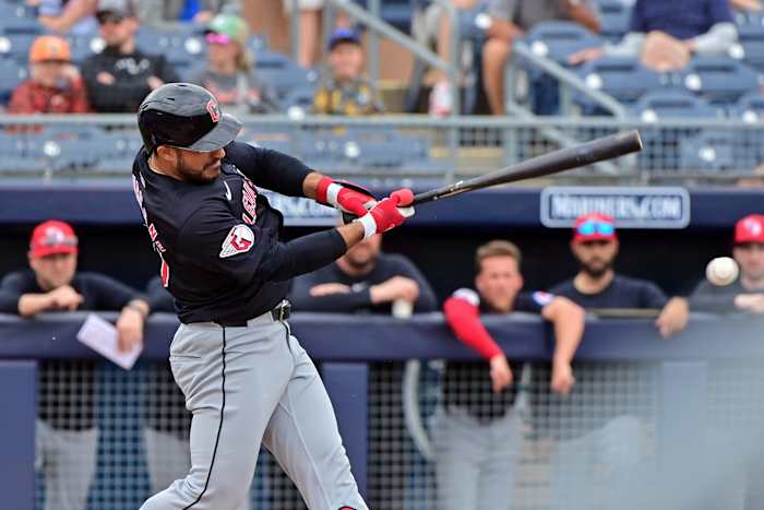 Feb 26, 2024; Peoria, Arizona, USA; Cleveland Guardians right fielder Ramon Laureano (10) singles in the first inning against the San Diego Padres during a spring training game at Peoria Sports Complex.